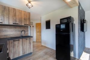 Kuchyň nebo kuchyňský kout v ubytování Honey apartments