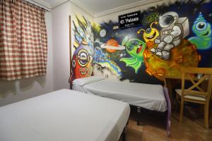 
A bed or beds in a room at El Volante
