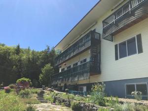 a building with balconies on the side of it at Coppertoppe Inn & Retreat Center in Hebron