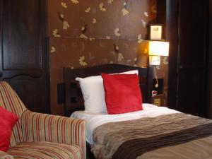 Tempat tidur dalam kamar di Masslink Guest House