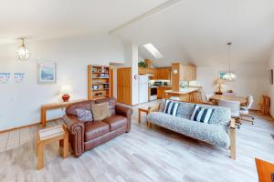 a living room with a couch and a chair at Captain Bill's Beachhouse in Lincoln City