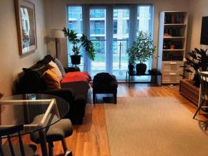 a living room with a couch and a table at Kingston Flat in Kingston upon Thames +1 photo