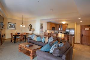a living room with a couch and a table at Comfortable 1 Bedroom Condo - Slopeside condo in Crested Butte