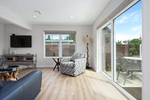 a living room with a couch and a tv at Escape Casey Key in Nokomis