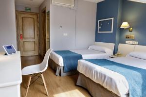 
Cama o camas de una habitación en Hotel Jakue
