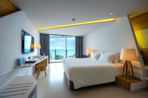 Postel nebo postele na pokoji v ubytování Centara Q Resort Rayong