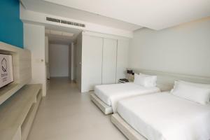 Postel nebo postele na pokoji v ubytování Centara Q Resort Rayong