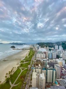 an aerial view of a city and the beach at Unlimited Ocean Front in Santos
