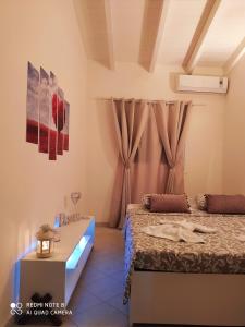 Postel nebo postele na pokoji v ubytování Agis Residence