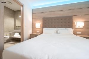 Postel nebo postele na pokoji v ubytování HOTEL TRILAGO
