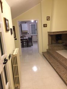 a hallway with a fireplace and a dining room at VILLA DEGLI ARCHI B&B - Ristorante in Castorano
