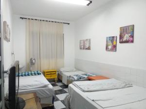 Uma cama ou camas num quarto em Orion Hostel Congonhas