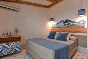 Postel nebo postele na pokoji v ubytování Hotel Garden Riviera