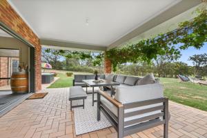 A seating area at Hunter Valley Vineyard Large Family Farm Houses - Ironstone Estate Lovedale