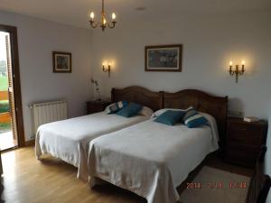 Postel nebo postele na pokoji v ubytování Hotel Azkue
