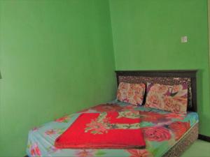 Ліжко або ліжка в номері Hotel Nirmala