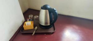 a blender sitting on a counter with a box at Mangkuyudan Hotel Solo in Lawean