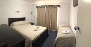 Ein Bett oder Betten in einem Zimmer der Unterkunft Carnarvon Gateway Motel