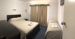 Postel nebo postele na pokoji v ubytování Carnarvon Gateway Motel