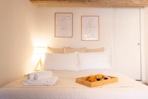 Posteľ alebo postele v izbe v ubytovaní ORANGE Tuscany Flat