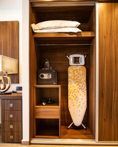a wooden shelf with a skateboard in it at Leonardo Boutique Hotel Larnaca in Larnaca
