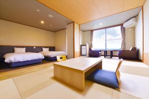 Letto o letti in una camera di Ooedo Onsen Monogatari Hotel Suiyotei