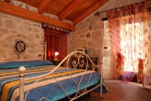 Postel nebo postele na pokoji v ubytování Country House Antiche Dimore