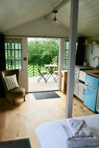 a kitchen with an open door to a patio at Castle Lodge in Sheriff Hutton