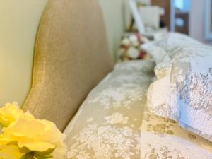 a close up of a bed with flowers on it at Le Moulin de Rudelle in Muret