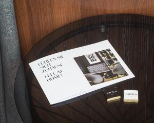 a table with a piece of paper and a keyboard at AMERON Hamburg Hotel Speicherstadt in Hamburg