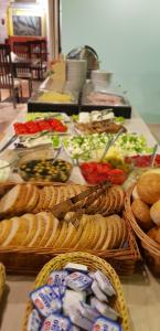 a buffet of sandwiches and other food on a table at Hotel Mazowiecki in Łódź