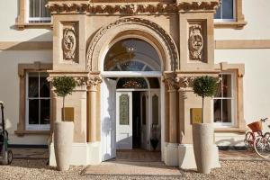 an entrance to a building with an archway at Lympstone Manor Hotel in Exmouth