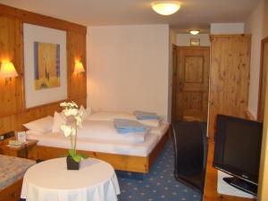 Postel nebo postele na pokoji v ubytování Hotel Schwarzenbergs Traube