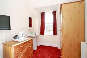 A television and/or entertainment center at CitiHouse Aberdeen West End 