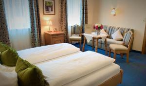 Un pat sau paturi într-o cameră la Hotel Plainbrücke | self check-in