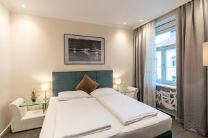 Rúm í herbergi á Altstadthotel Wolf-Dietrich
