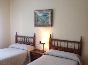 Posteľ alebo postele v izbe v ubytovaní Hostal Argentino