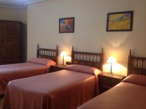 Posteľ alebo postele v izbe v ubytovaní Hostal Argentino