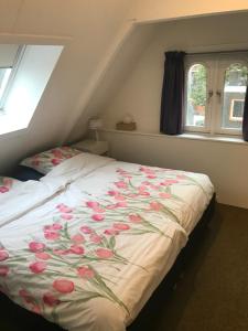 Postel nebo postele na pokoji v ubytování B&B De Duinhoek