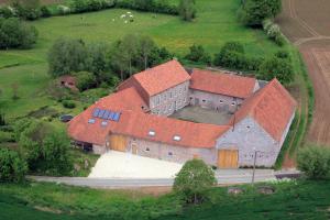 an aerial view of a large building with red roofs at B&B Hof Ter Haegen in Vollezele