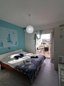 Postel nebo postele na pokoji v ubytování Apartmani Paula