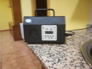 a black appliance sitting on top of a counter at Apartaments la Fabrica in Horta de San Joan