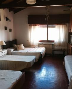 A bed or beds in a room at Cruz del Sur