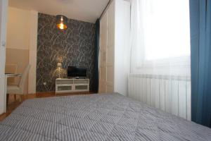 Ένα ή περισσότερα κρεβάτια σε δωμάτιο στο Apartment Bg Arena +4 φωτογραφίες