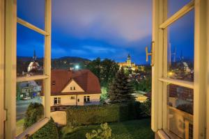 a large window with a view of a city at Penzion Gardena in Český Krumlov