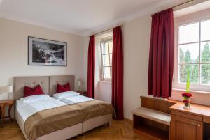 Rúm í herbergi á Altstadthotel Wolf-Dietrich