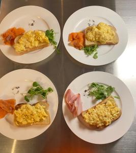 four plates of breakfast food on a table at The White House Hotel in Newquay