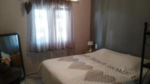 Łóżko lub łóżka w pokoju w obiekcie VILLA DOS-LAGOS