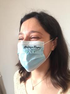 a woman wearing a face mask with writing on it at Hosteria Rayen in La Junta