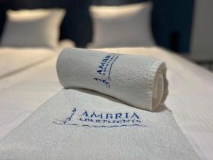 Łóżko lub łóżka w pokoju w obiekcie Ambria Apartments Promenada